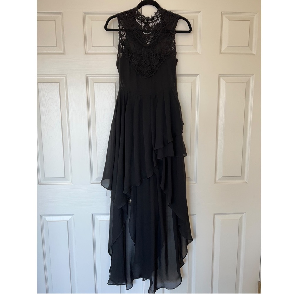 Beautiful asymmetrical dress 100% polyester with lace embellishment worn once